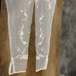 White Sleeves that are beaded.